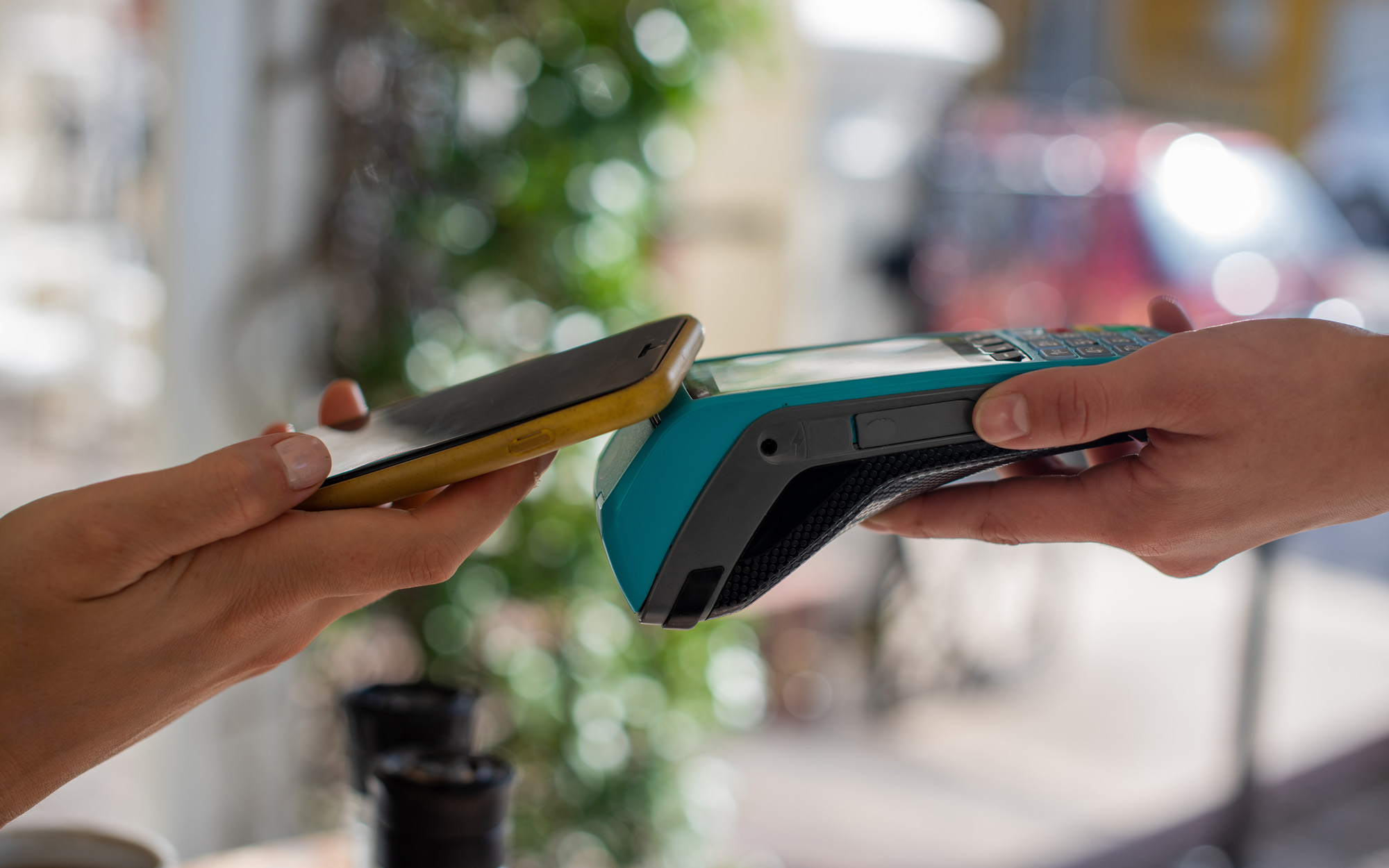 Close up shot of person making a payment with cellphone