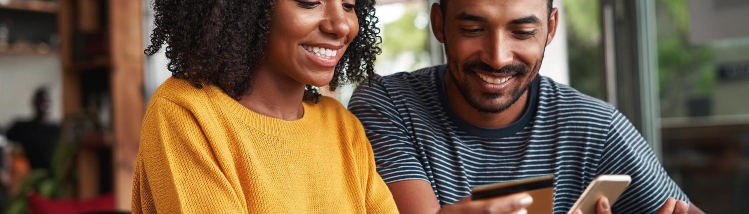 Man looking at his girlfriend shopping online in cafe? Man looking at his girlfriend shopping online in cafe?