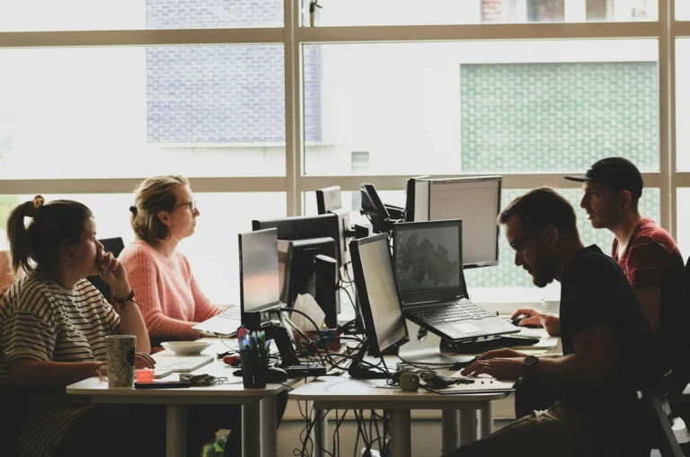 The channel manager's operations team at their screens in a bright office